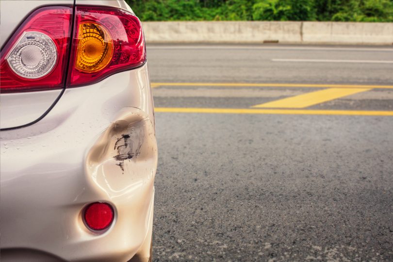 car has dented rear bumper damaged after accident