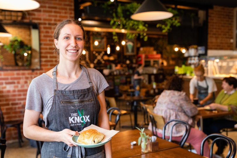 Waitress with plate of food