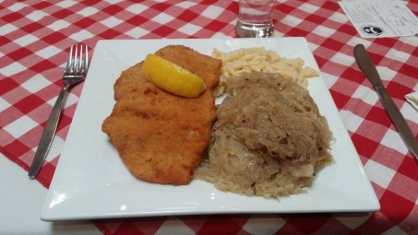 Pork Schnitzel from the Austrian Club, served with sauerkraut and spaetzle and made with love.