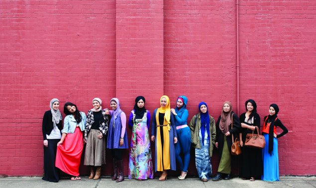 Muslim fashion bloggers Delina Darusman-Gala and Mya Arifin with a group of friends. Photo: Marinco Kojdanovski © Museum of Applied Arts and Sciences, Sydney.