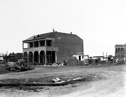 Building in progress showing how both buildings were built in sections. Image courtesy of National Archives of Australia: A3560, 2573