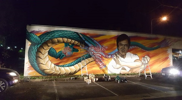 Graffiti artists honour Jackie Chan with Dickson gift