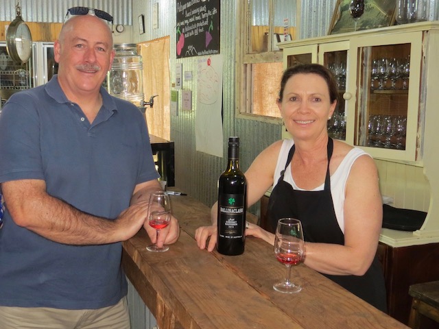 Peter Moore sampling wine with orchardist Cath Mullany. Photo: John Thistleton