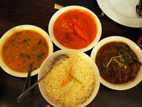 A selection of boneless lamb, butter chicken and daal