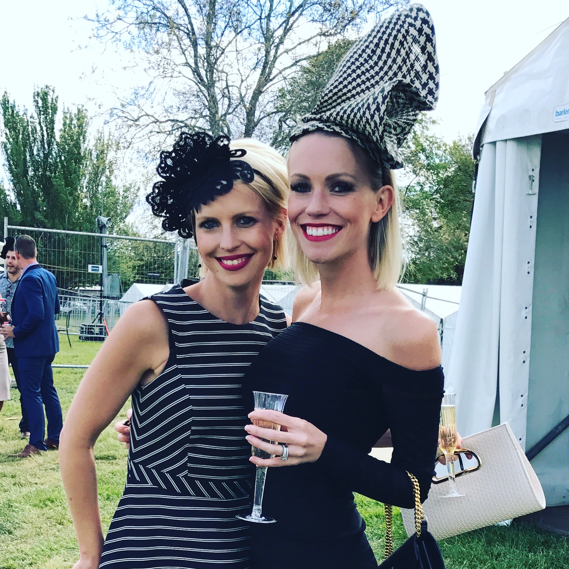 Danielle Ridgway and Alyse Allender. Ms Allender created the fascinator her sister is wearing and her own stunning hat. Photo: Charlotte Harper