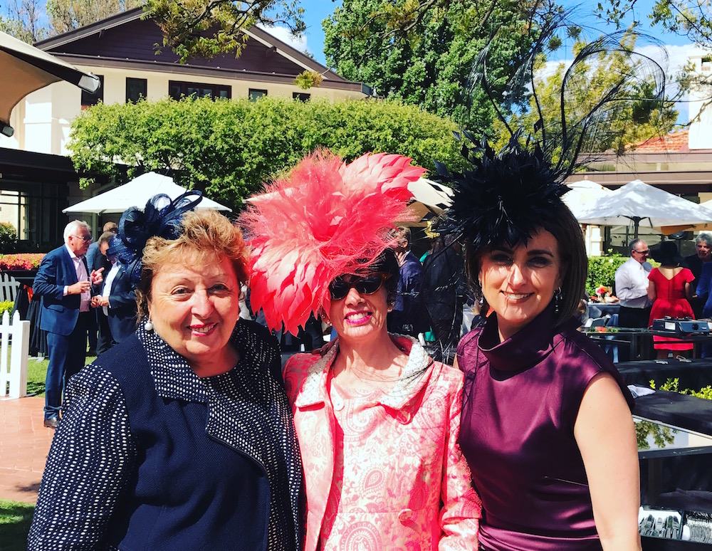 Sophia Haridemos, Cynthia Jones-Bryson and Melba Haridemos at the Hyatt. Ms Jones-Bryson is an award-winning milliner who will on Thursday judge the millinery award at Oaks Day at Flemington. The hats that she and Ms Melba Haridemos are wearing are her own creations. Photo: Charlotte Harper