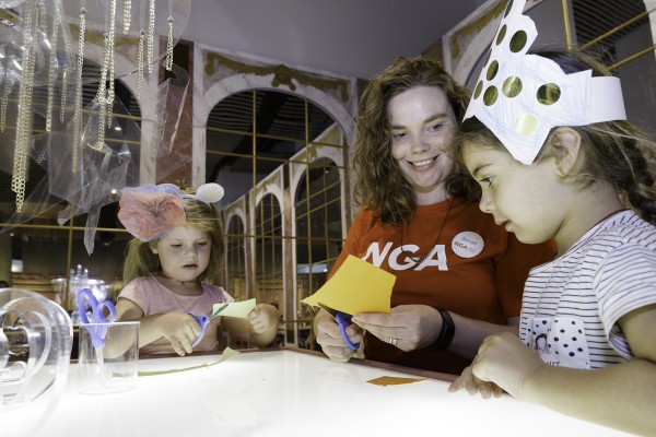 Children crafting at the chandelier-making table. Photo: NGA