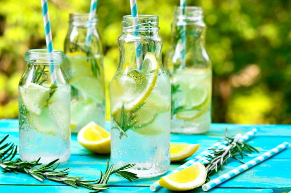 Citrus fizz with rosemary in a bottle.