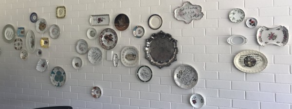 Eclectic vintage china on the wall at Bonkers. Photo: Charlotte Harper