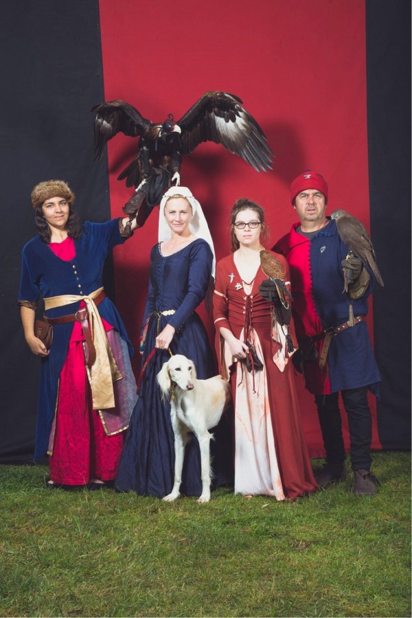 People in medieval costume with a falcon