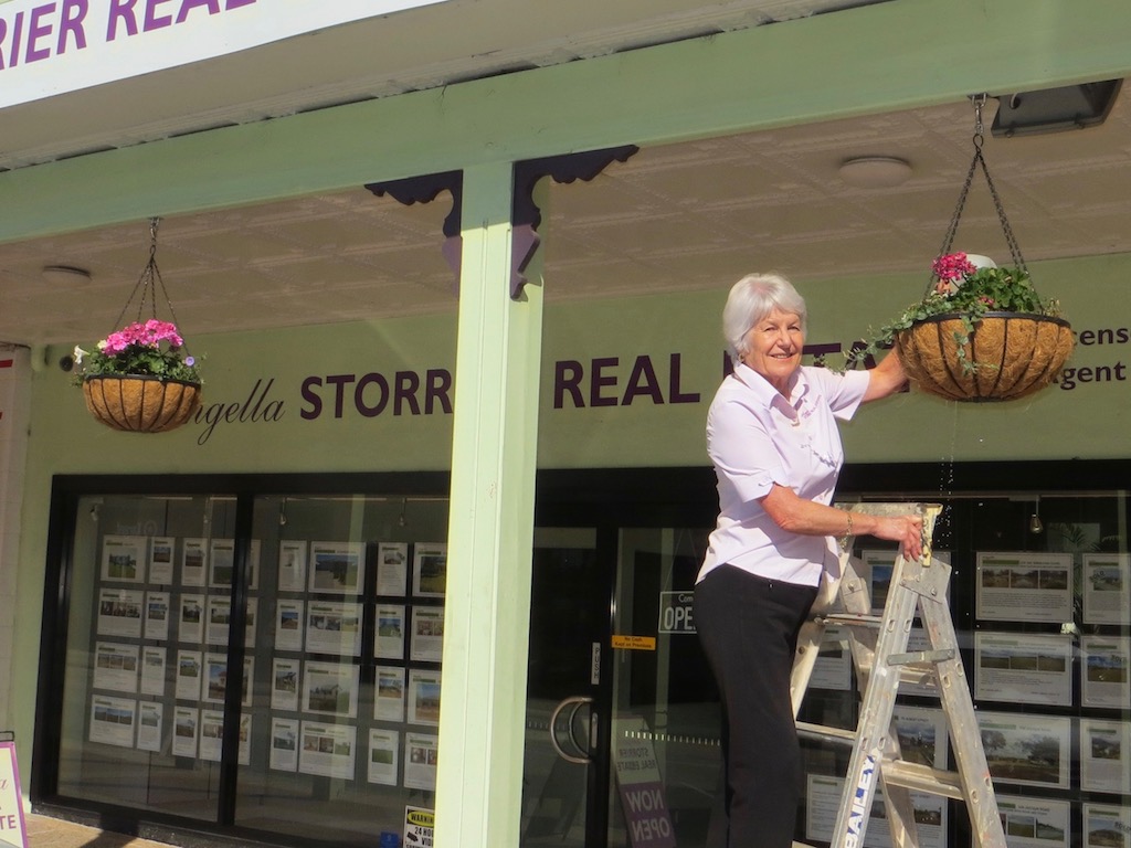 Above: Angella Storrier tends to her flowers. Below: Susan Feld welcomes customers. Photos John Thistleton