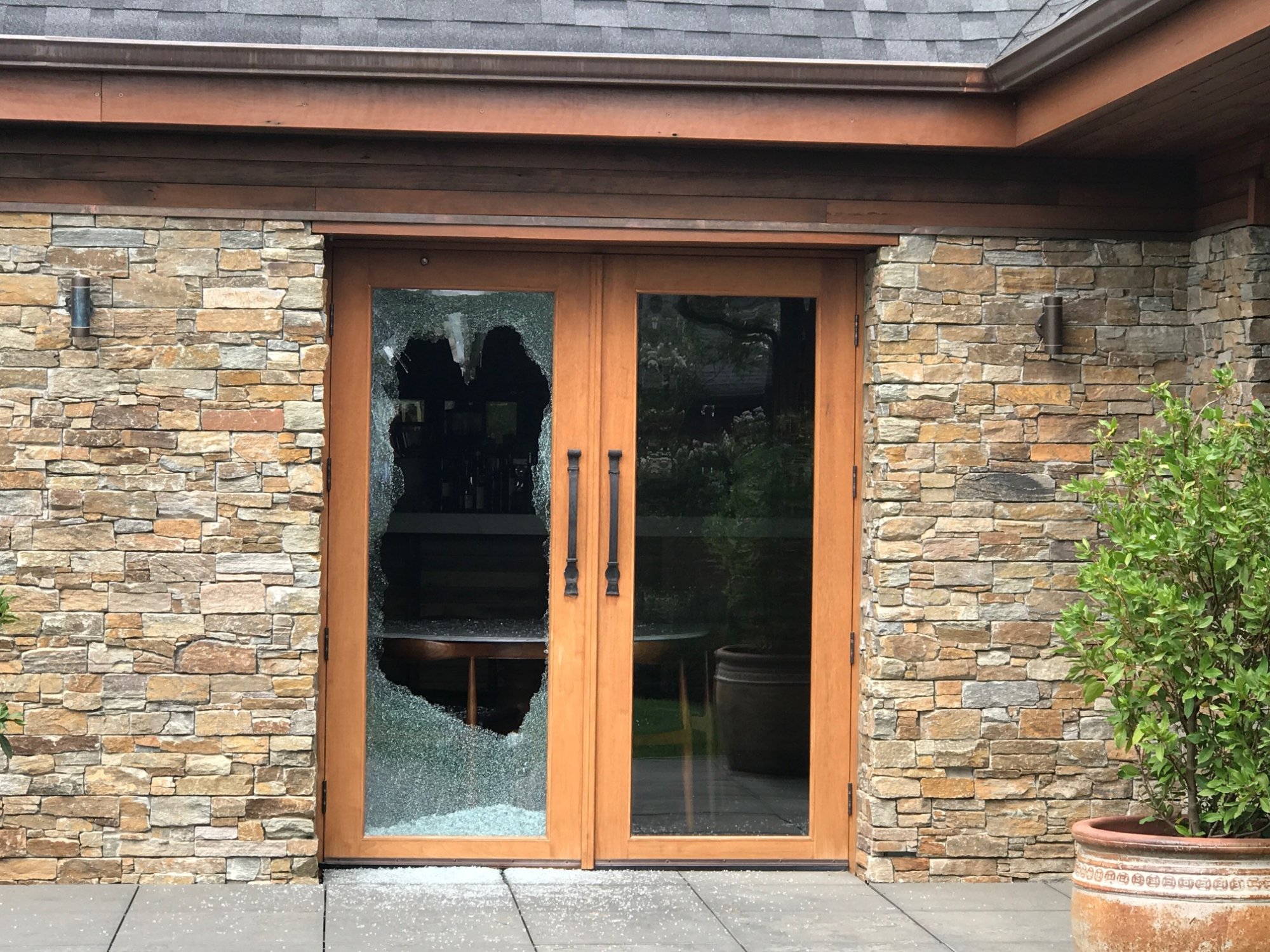 Pialligo Estate Farmhouse with one glass door panel destroyed. Photo: Charlotte Harper