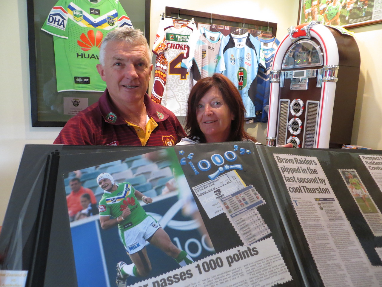Greg and Pauline Croker with a scrapbook of their son's achievements. Photo: John Thistleton.