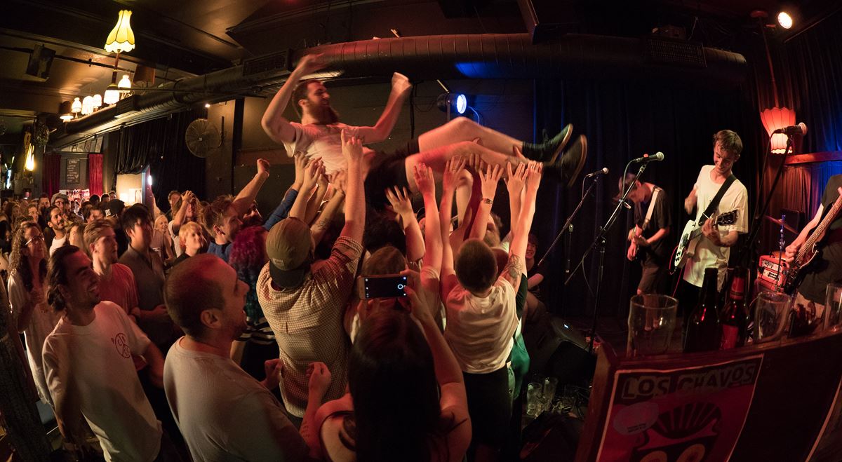 Jim Dusty crowdsurfing to Capes Patrick Cox