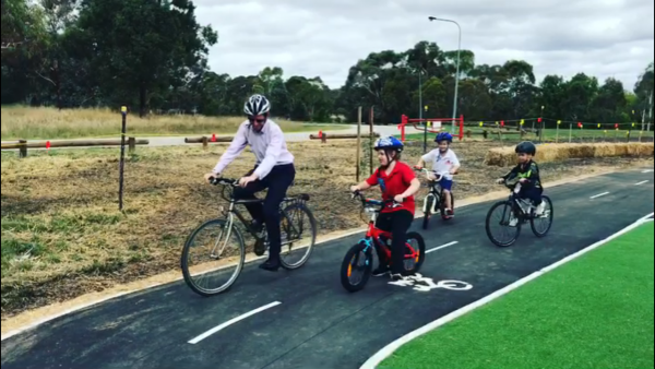 ACT Minister for Road Safety Shane Rattenbury with participants in the Cyclabilities program at the opening of the Tuggeranong Learn to Ride centre. Photo: Still from Facebook live video 