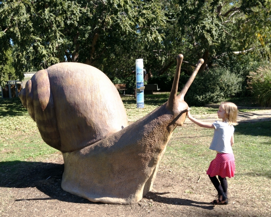 Ellie with Giant Snail in Sensory Garden