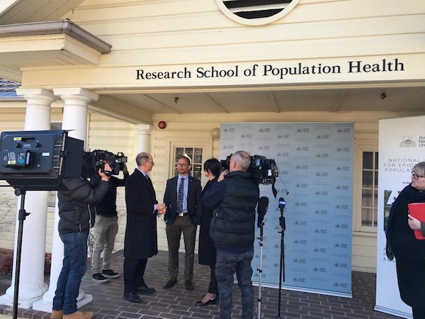 Chief Investigator Associate Professor Martyn Kirk, and leader of the final report Dr Rosemary Korda with ACT Chief Health Officer Dr Paul Kelly. Photo: Charlotte Harper 