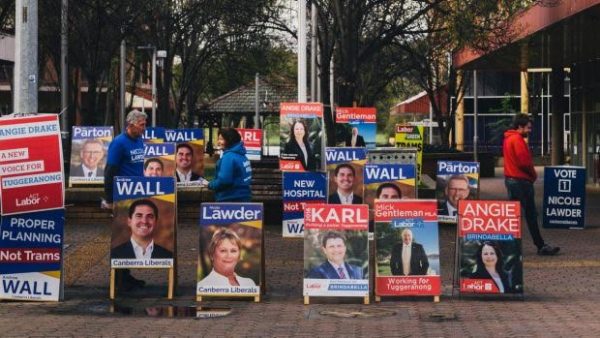 Election advertising signs outside polling centre.