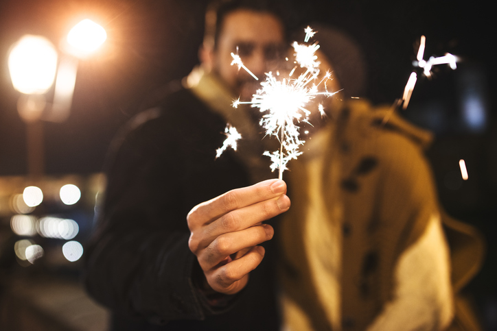 couple holding a sparkler