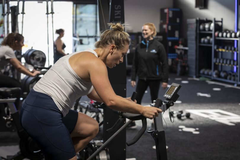 Person exercising on bike erg