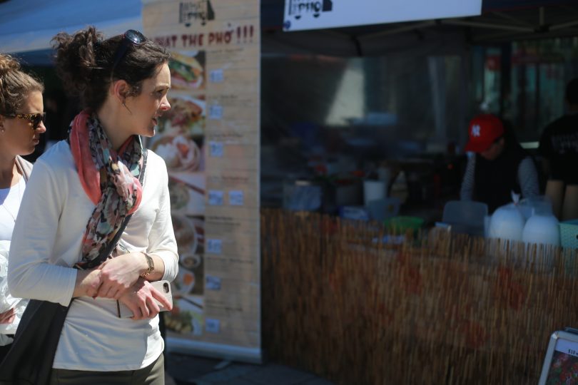 woman looking at stall