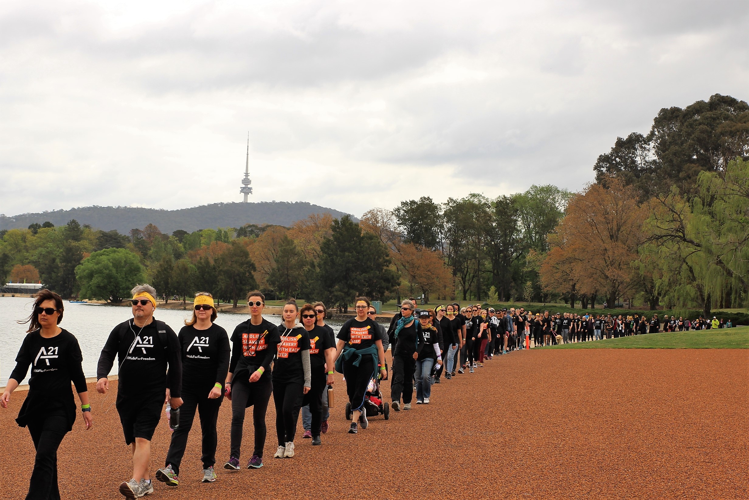 Canberrans stage silent single-file walk to call for end to modern-day slavery