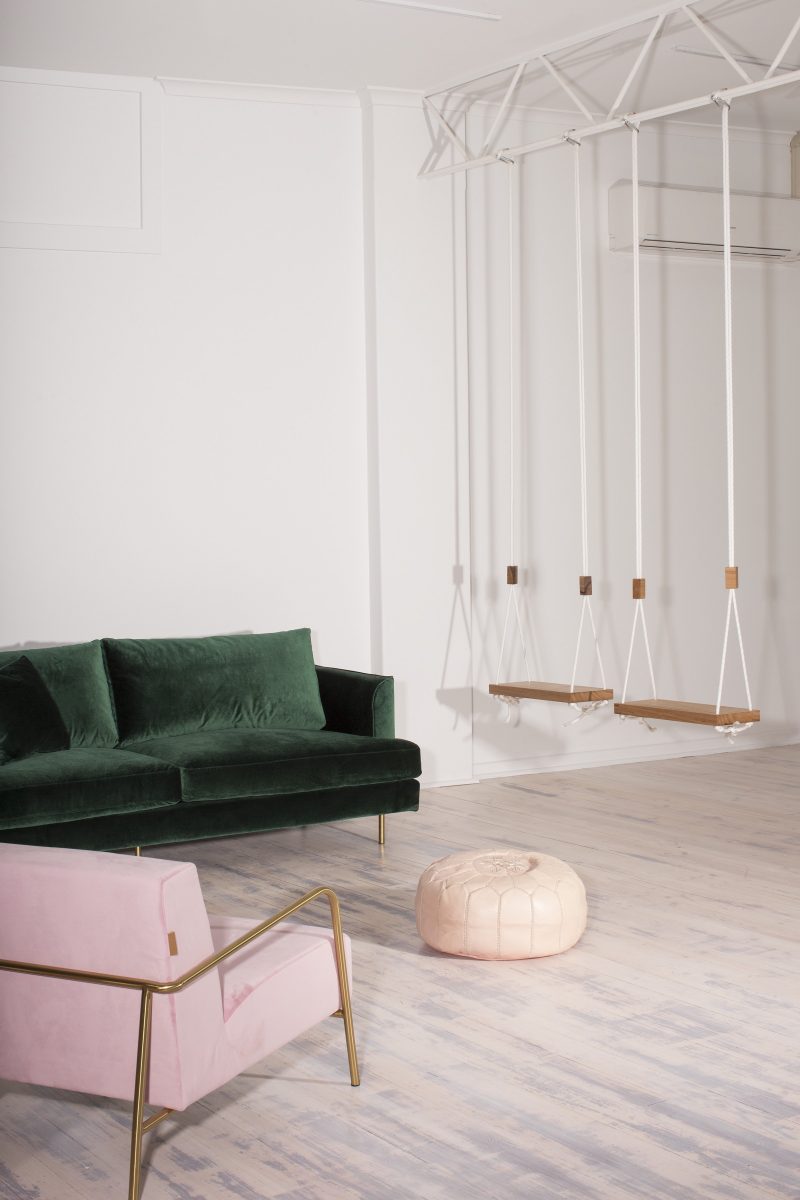 Some unique elements that add extra personality to the space including a blush pink SMEG fridge, handmade timber swings