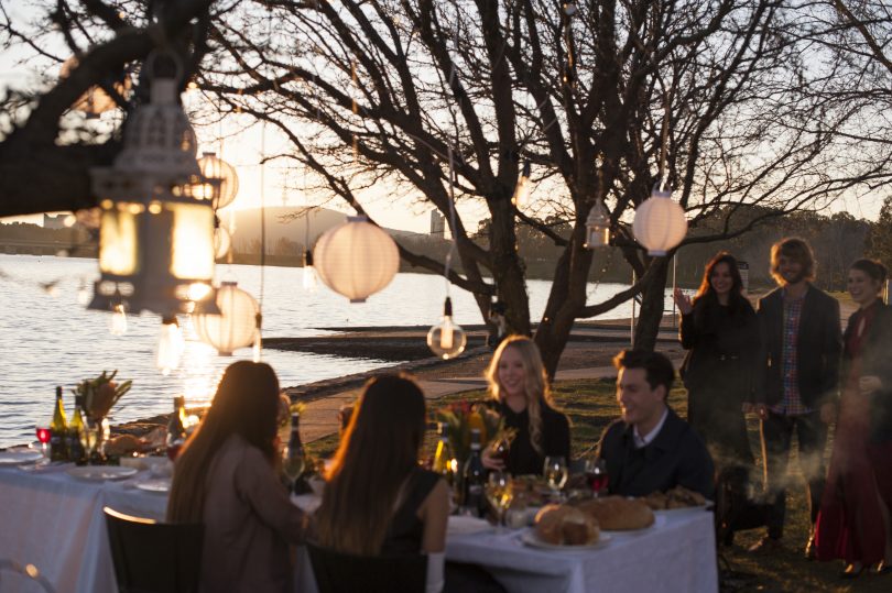 people dining by Lake Burley Griffin. 