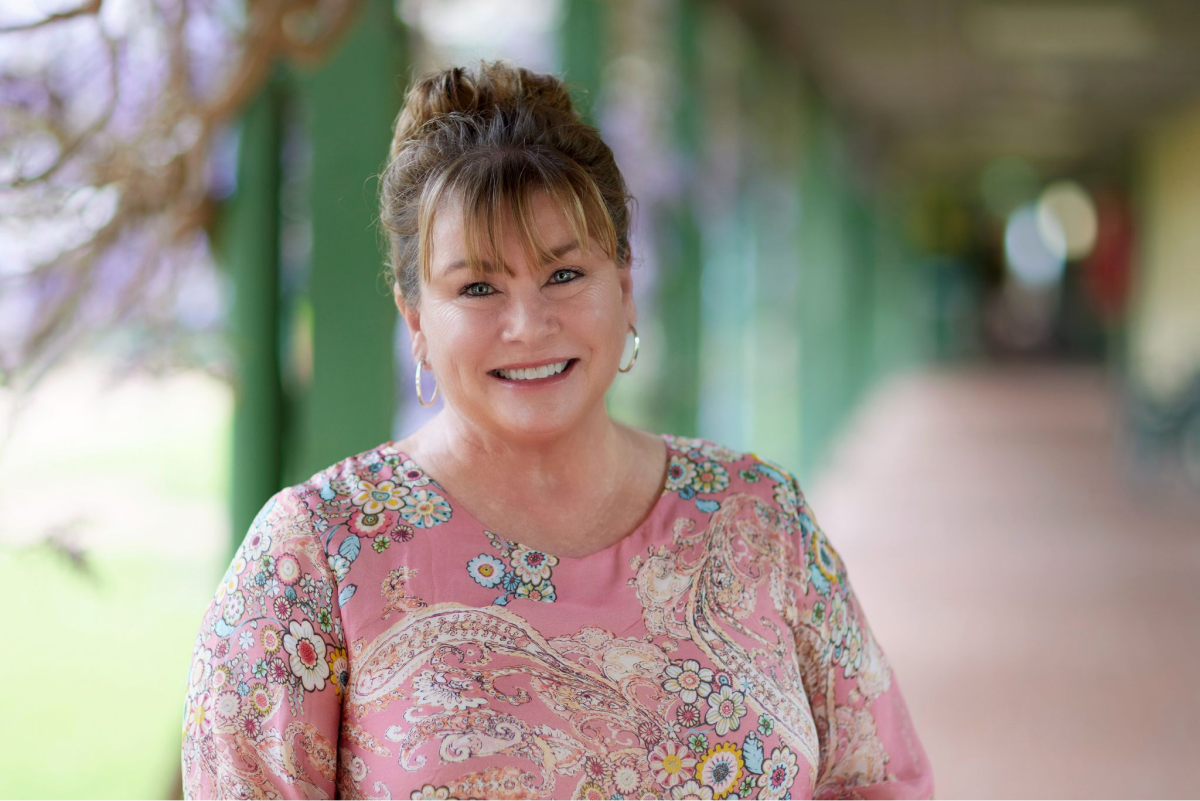 Kate Prior standing outside in a walkway