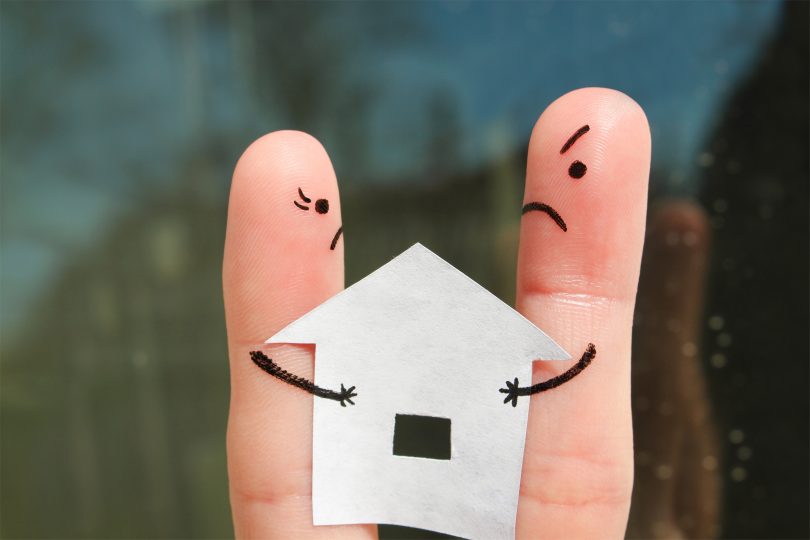 finger depictions of a couple fighting over a house