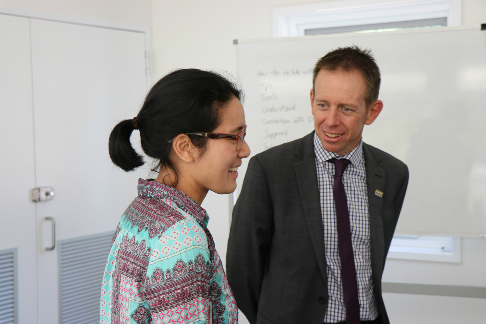 Minister Rattenbury talking to Julia, Health Promotion Officer at Women's Centre for Health Matters