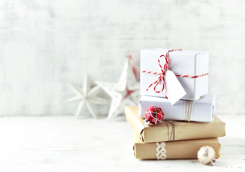 An Arrangement of Christmas Presents wrapped in gift paper in natural shades