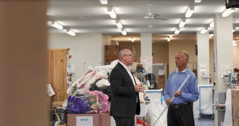 Todd Eagles, Manager - Energy Efficiency, from ActewAGL and Paul Quinn, St Vincent de Paul Canberra’s Regional Manager discuss the lighting upgrade in the Tuggeranong workshop.
