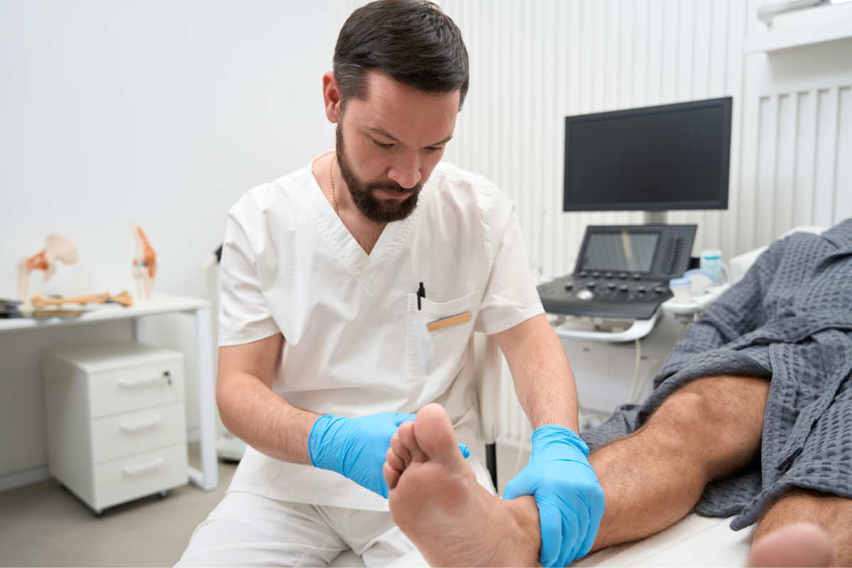 a doctor inspecting a patient's foot