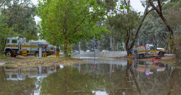Canberra mops up after downpour causes flash flooding