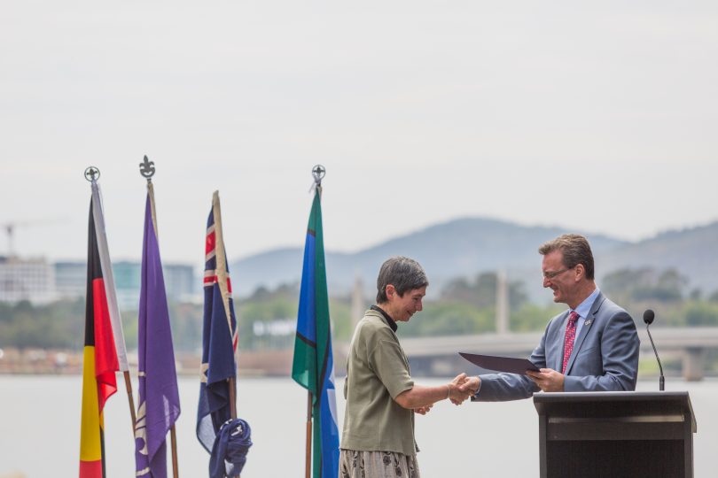 Dr Sue Wareham receives the inaugural Chief Minister's Rotary Peace Prize from Attorney-General and Minister for the Arts and Community Events, Gordon Ramsay.