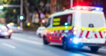 Two men taken to hospital after motorcyclist and pedestrian collide in Belconnen