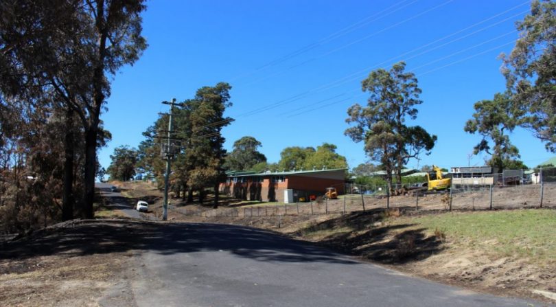 The schools boundary with Pacific Street where 120 trees have had to be removed, a fence and shade sail were also destroyed. Photo: Ian Campbell.