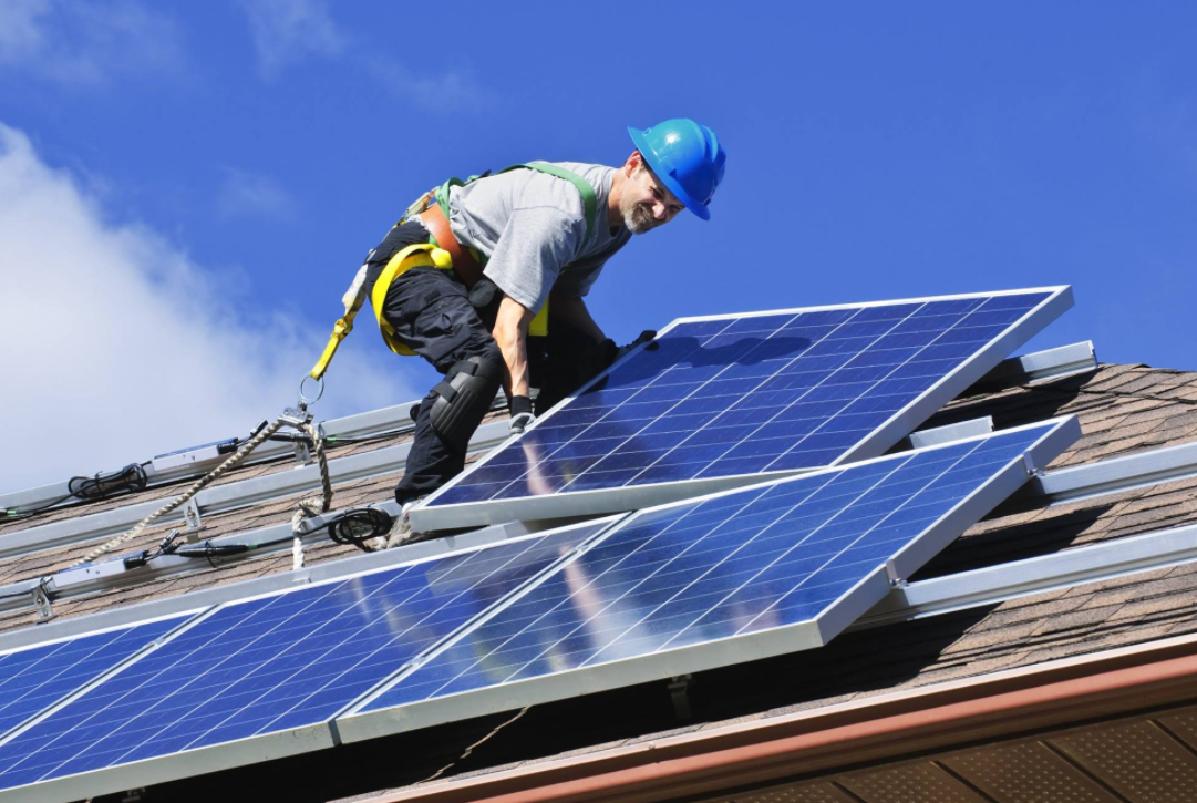 Man installing solar panels