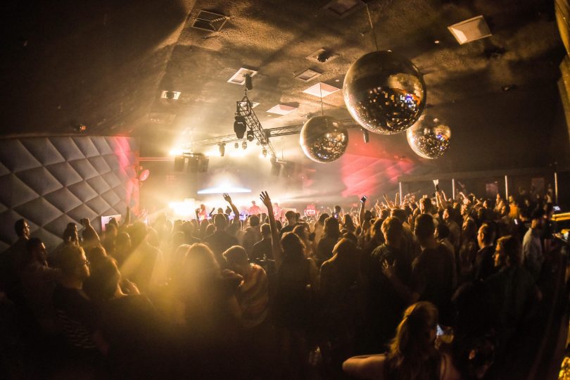 Interior of nightclub, mirror balls hanging from roof