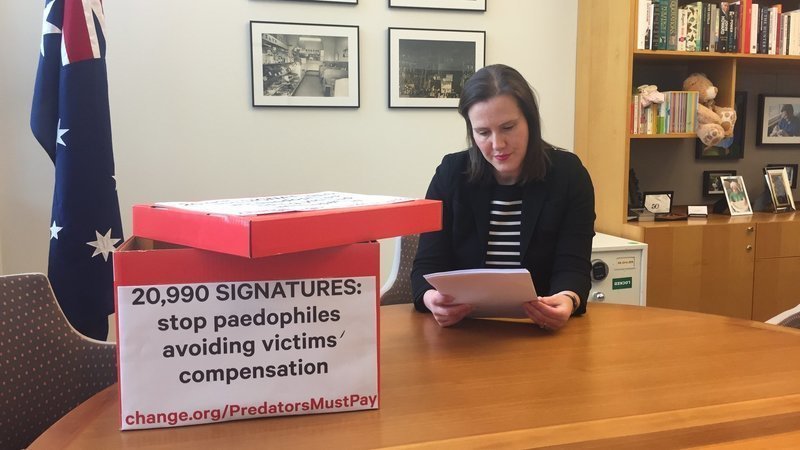 Minister Kelly O'Dwyer reads through the Change.org petition which attracted 21,314 signatures. Photo: supplied.