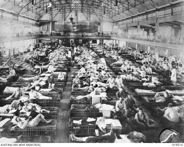 Nurses tend to casualties from Gallipoli in the former skating rink in Cairo. Photo: Australian War Memorial.