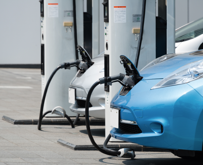 Two electric vehicles charging.