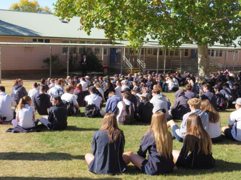 School children sitting at an assembly