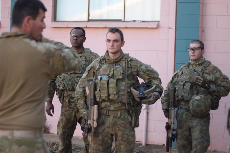 Senior cadets Bulungol, Baker, and Willems, receive instruction from WO2 Paris in Cooma. Photo: RMC Duntroon Facebook.