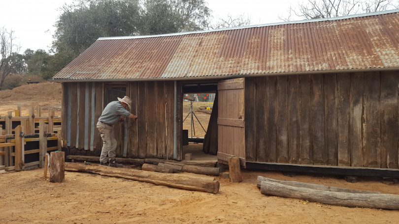 Myles Gostelow works on the slab building at the historic Blundells Cottage site. Photo: NCA