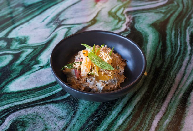 Coconut rice pudding with citrus and sesame. Image supplied