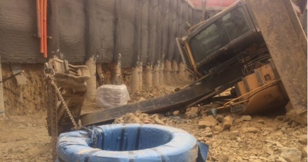 Workers lucky to escape injury as 15-tonne excavator rolls over on Civic construction site