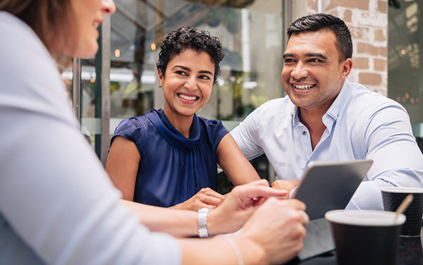 couple talking to mortgage broker