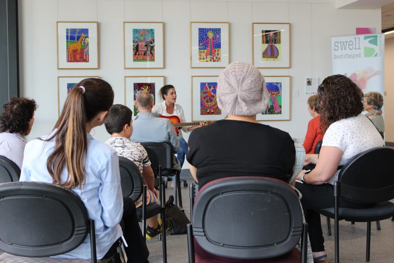 Chelsy Atkins pulled a crowd in April, with Miriam Kidd's art as the backdrop. Photo: Ian Campbell.